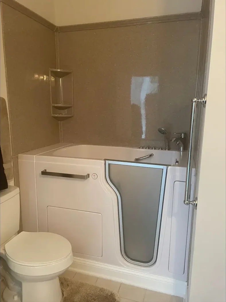 Walk-in tub with a sealed door and grab bars after remodeling